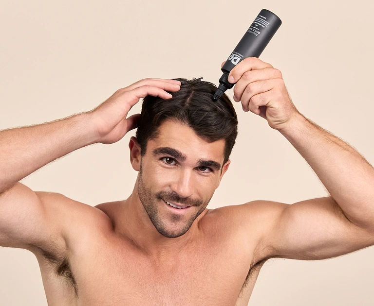 Image of model applying EXO-GROW SCALP MASK on scalp