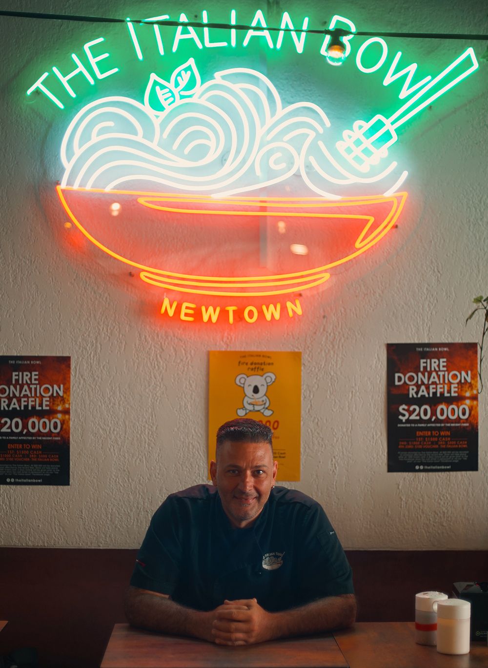 A vibrant LED neon created for The Italian Bowl, glowing bright in Newtown Sydney