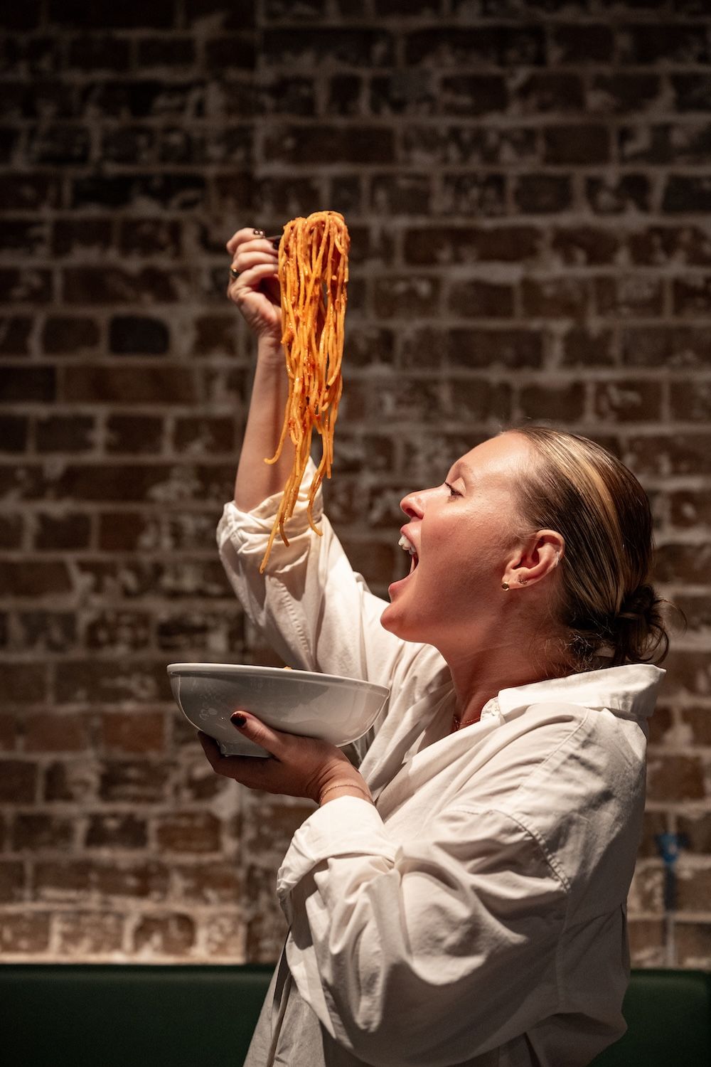 Woman eating pasta
