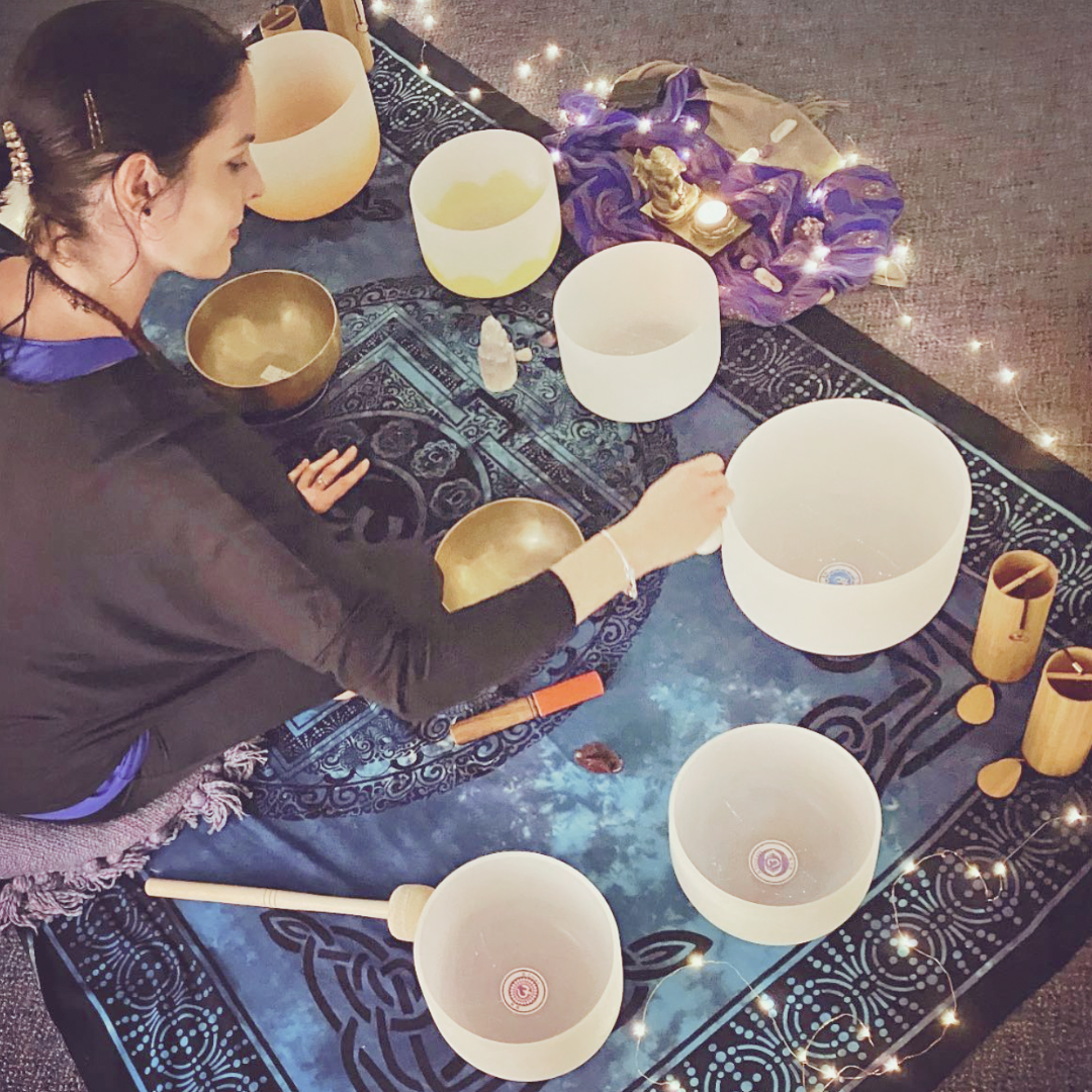 Natalie playing crystal singing bowls.