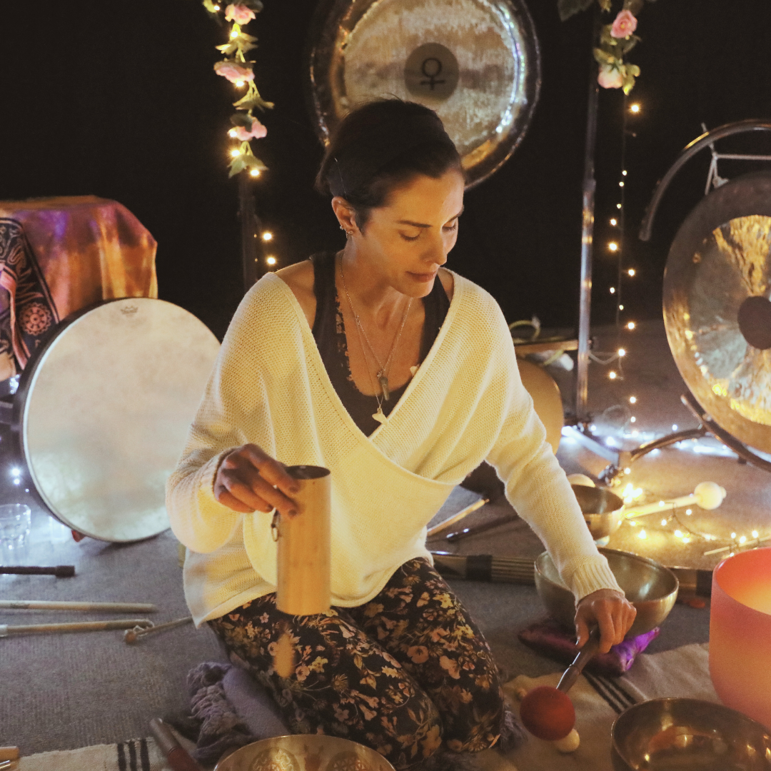 Natalie Grace playing Koshi chimes with other therapeutic instruments in the background.