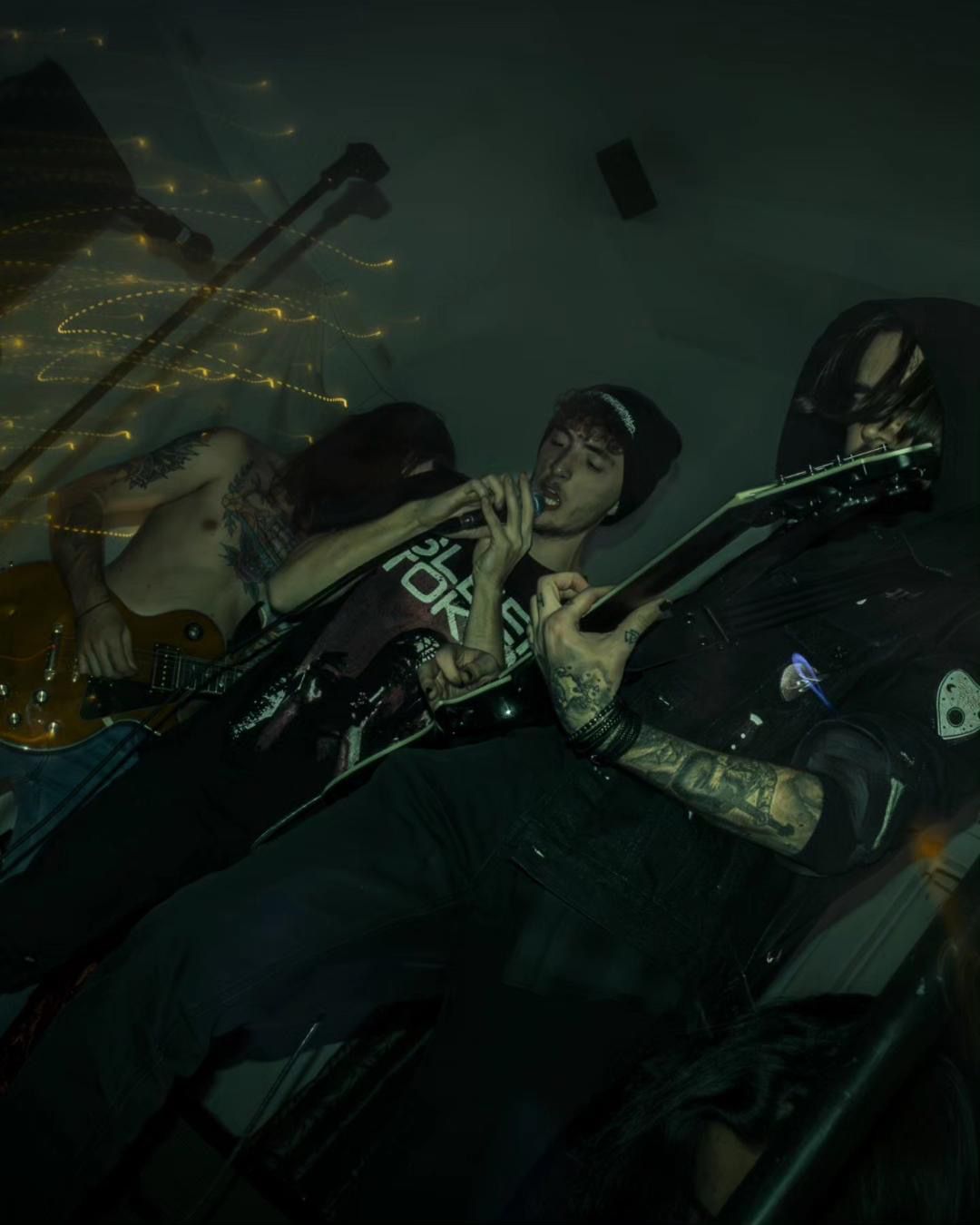 Band members performing live at a venue