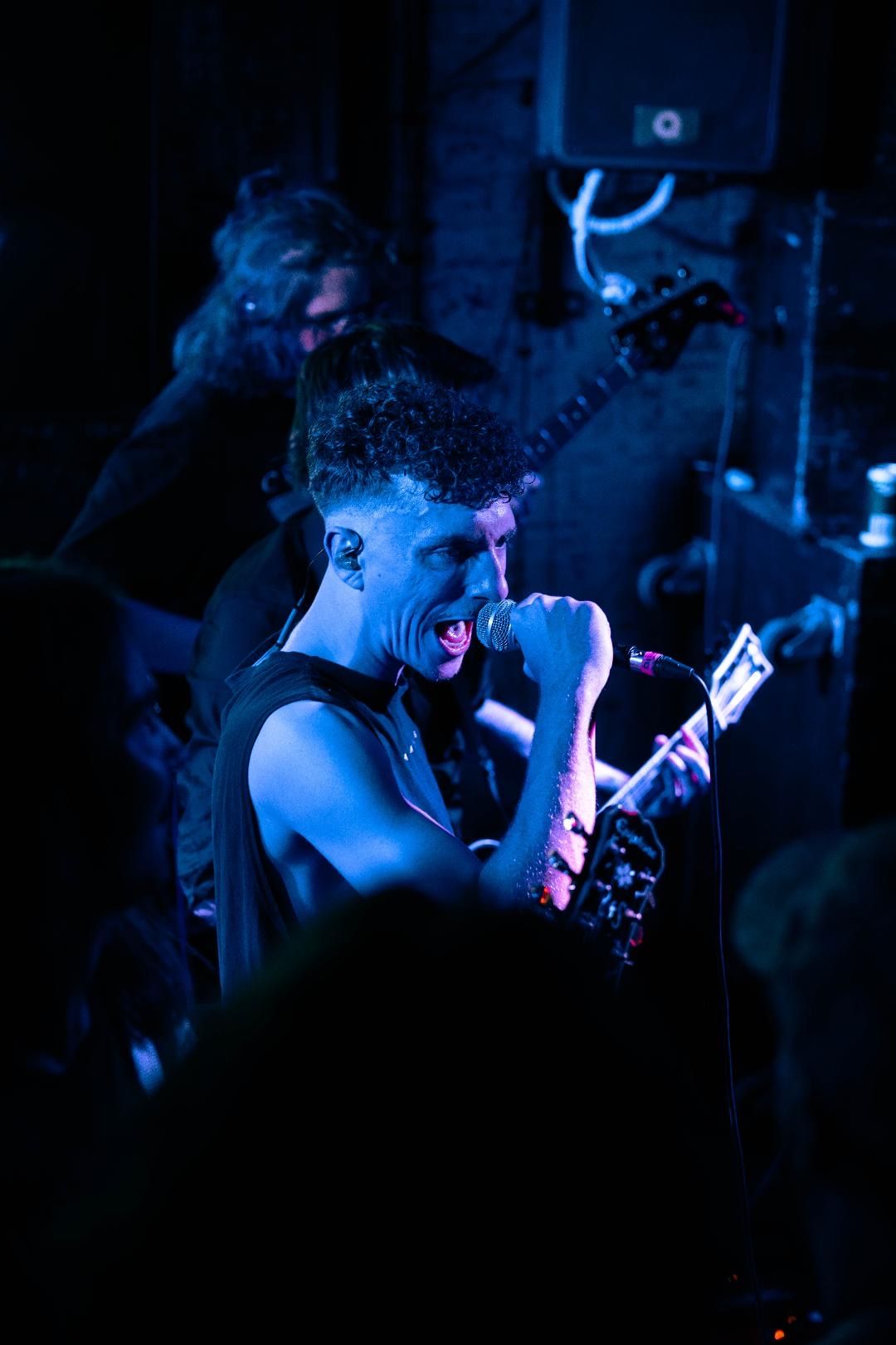 Band members performing live at a venue