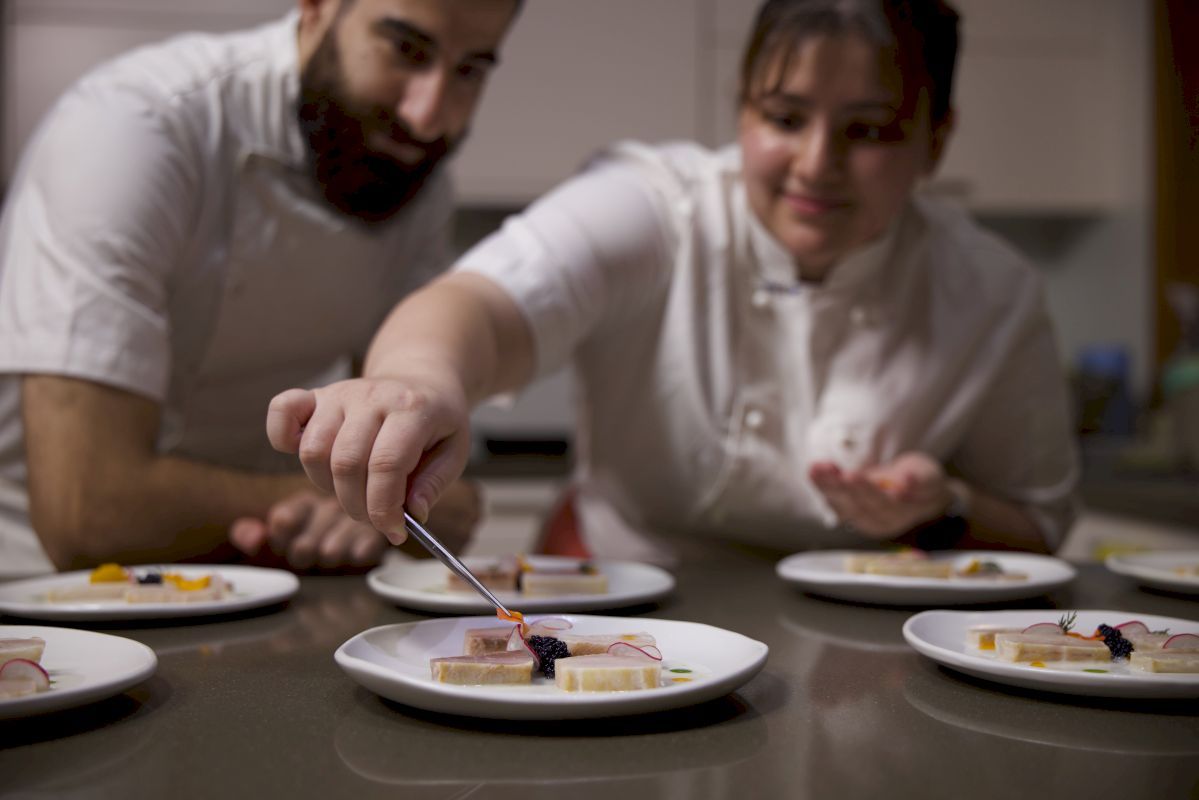 Chef Yasin & Chef Hannah plating kingfish crudo
