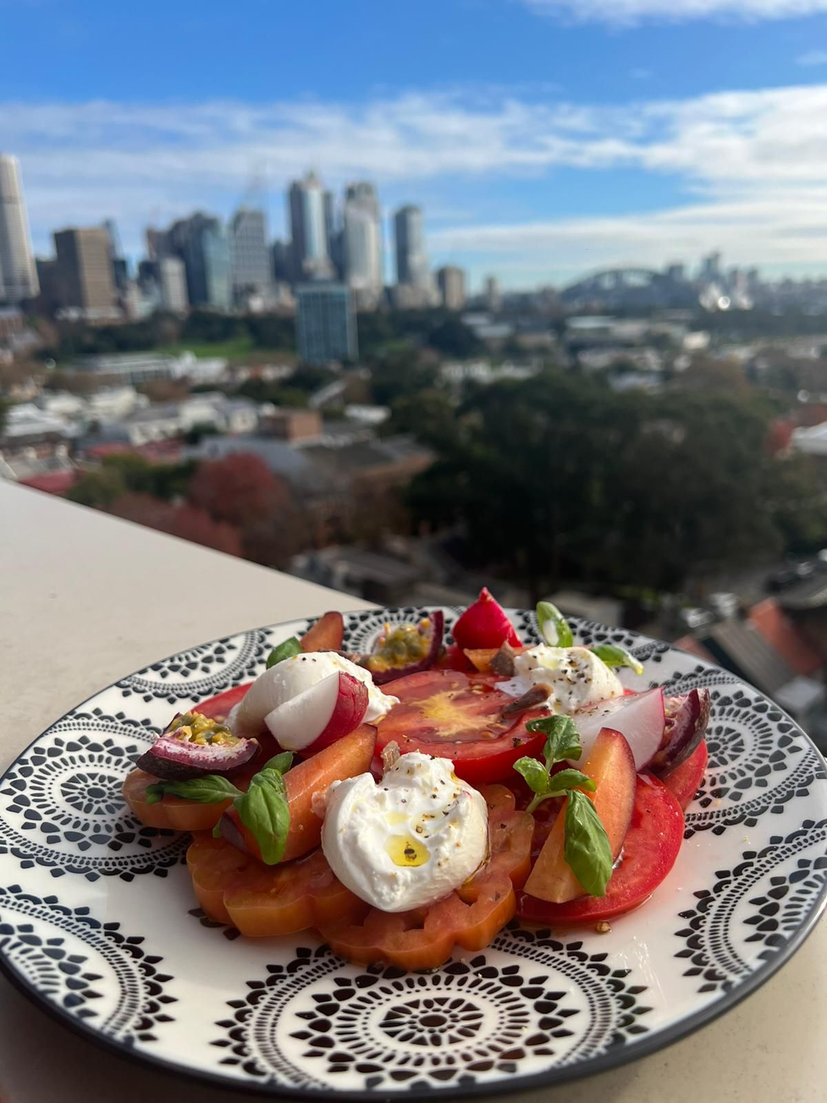Chef Vaclav Vit presenting tomato carpaccio, burrata