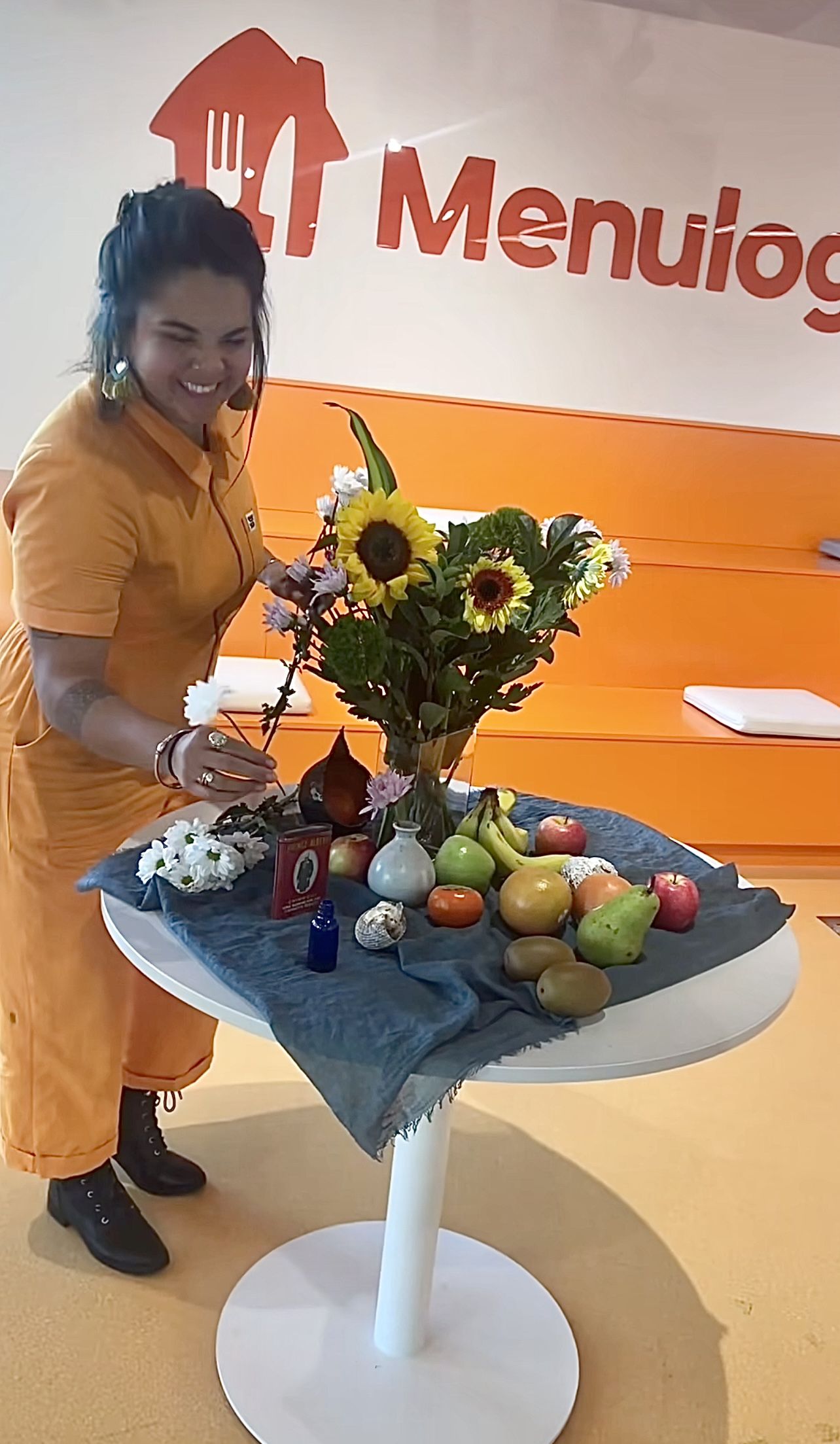 Manu setting up a table composition for a Still Life drawing class
