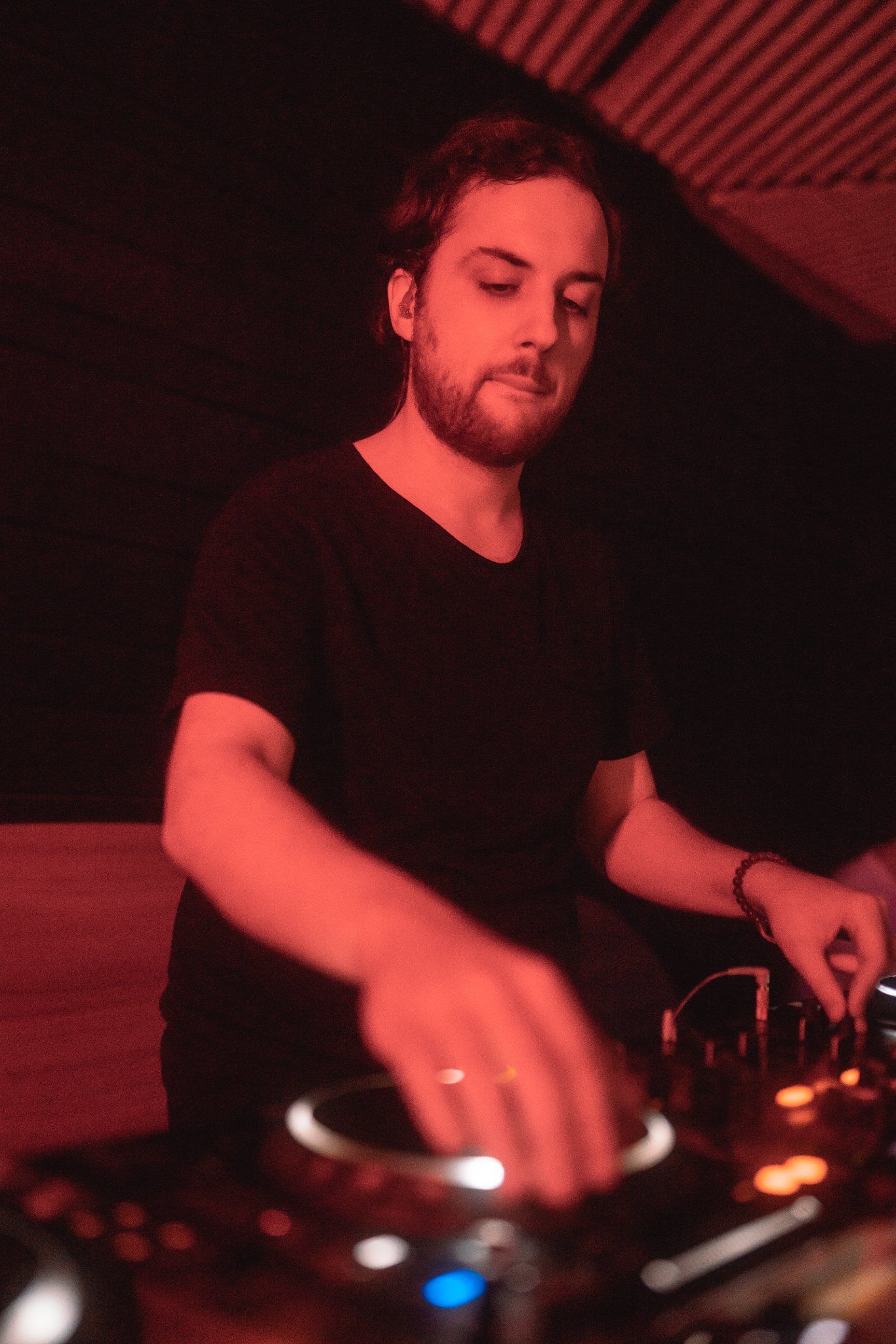 DJ Discopoly in the zone performing on stage.