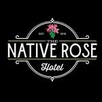Logo for The Native Rose Hotel, featuring a pink rose above the name in white text, framed by decorative circular lines on a black background.