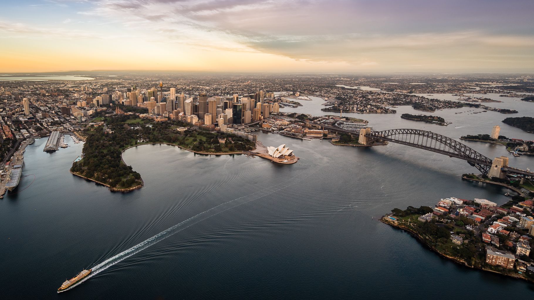 Aerial image of Sydney cityscape showing the city, Opera House and Harbour Bridge