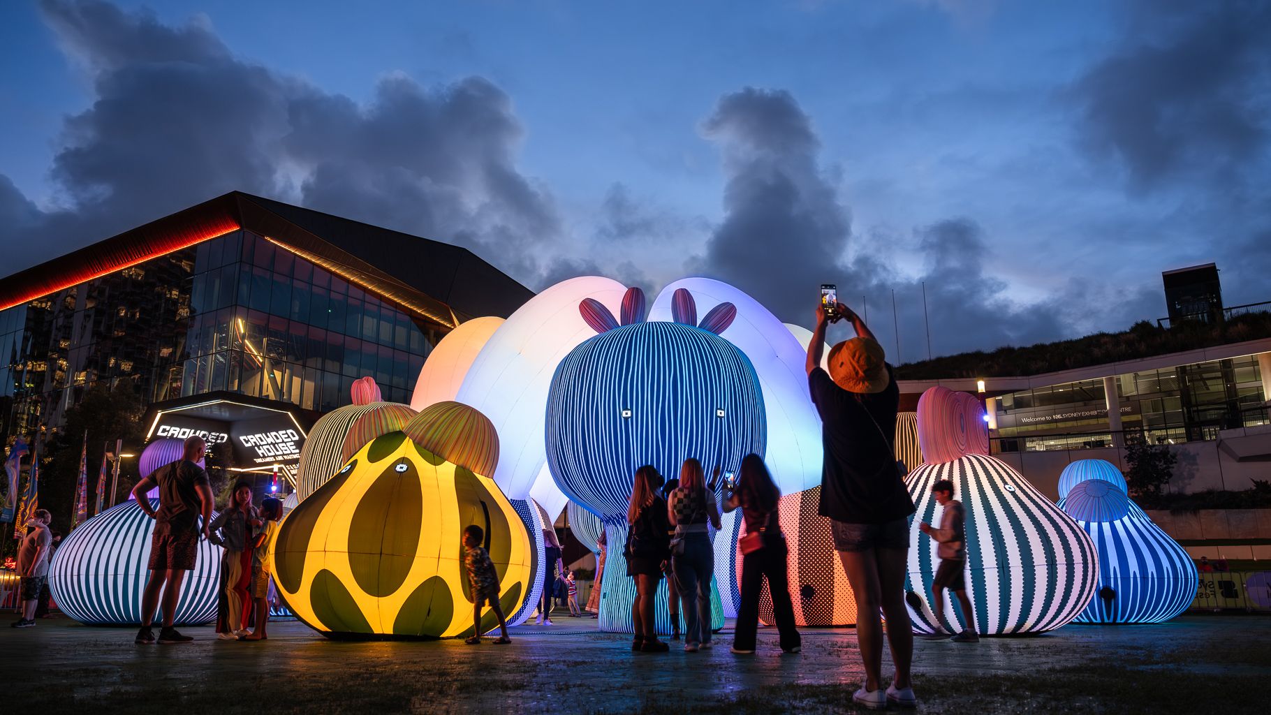 People around an inflatable light installation in front of ICC Sydney Theatre