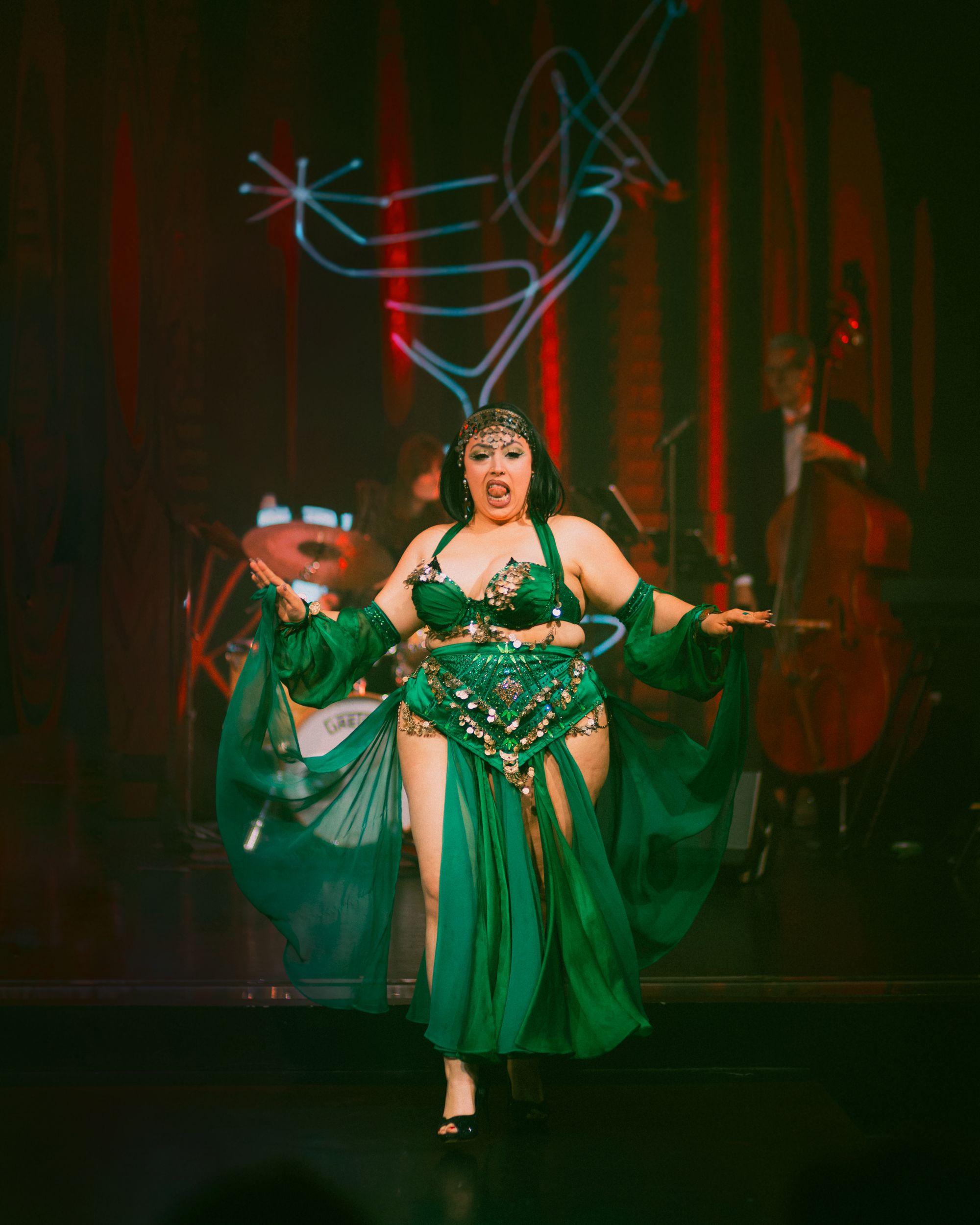 Demon Derriere performing Egyptian Woman at Whoop Dee Doo. Wearing a custom green outfit desIgned by Keira S.