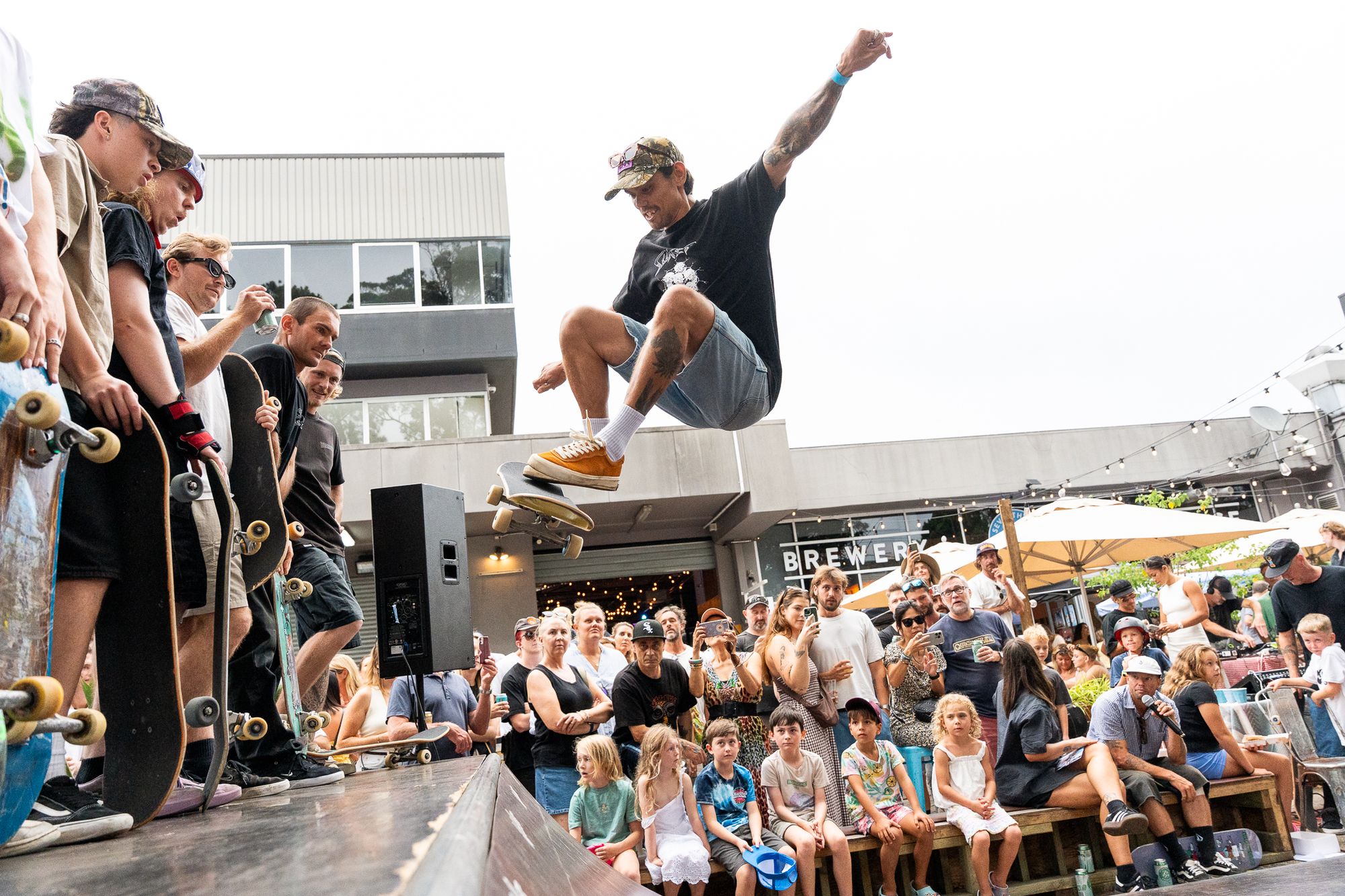 Skateboarder doing a trick on a skate ramp