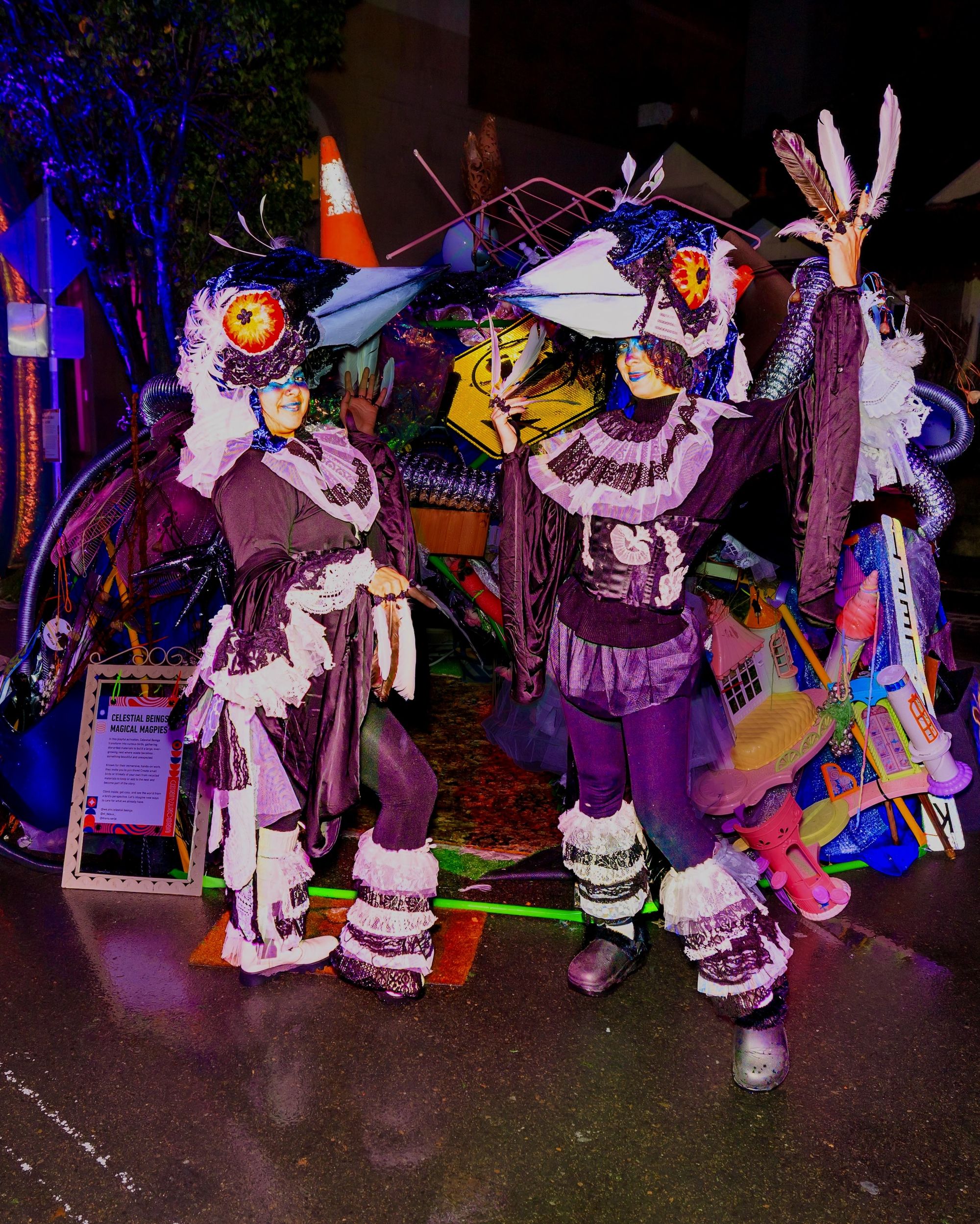 The Magical Magpies in costume standing in front of the Magical magpie Nest all made from found objects and materials