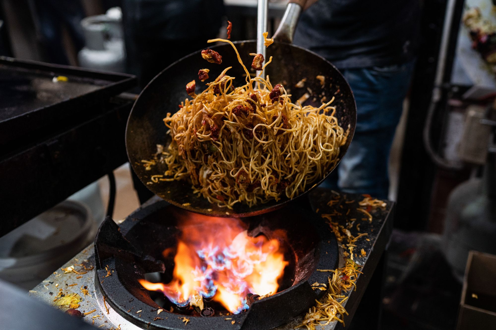 Stir-fry is tossed over coal