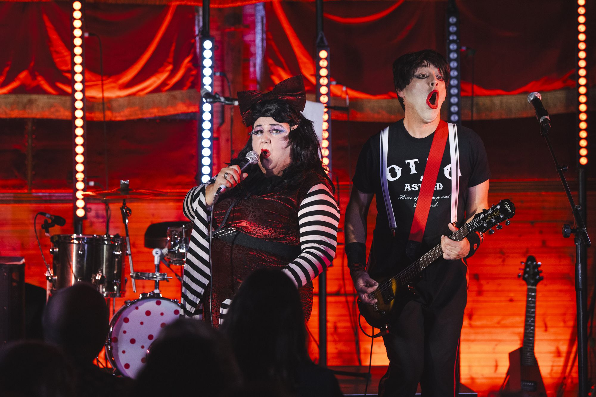 Otto and Astrid, the over the top punk rock sibling duo, perform on stage in their signature costume which is The White Stripes meets Sid Vicious