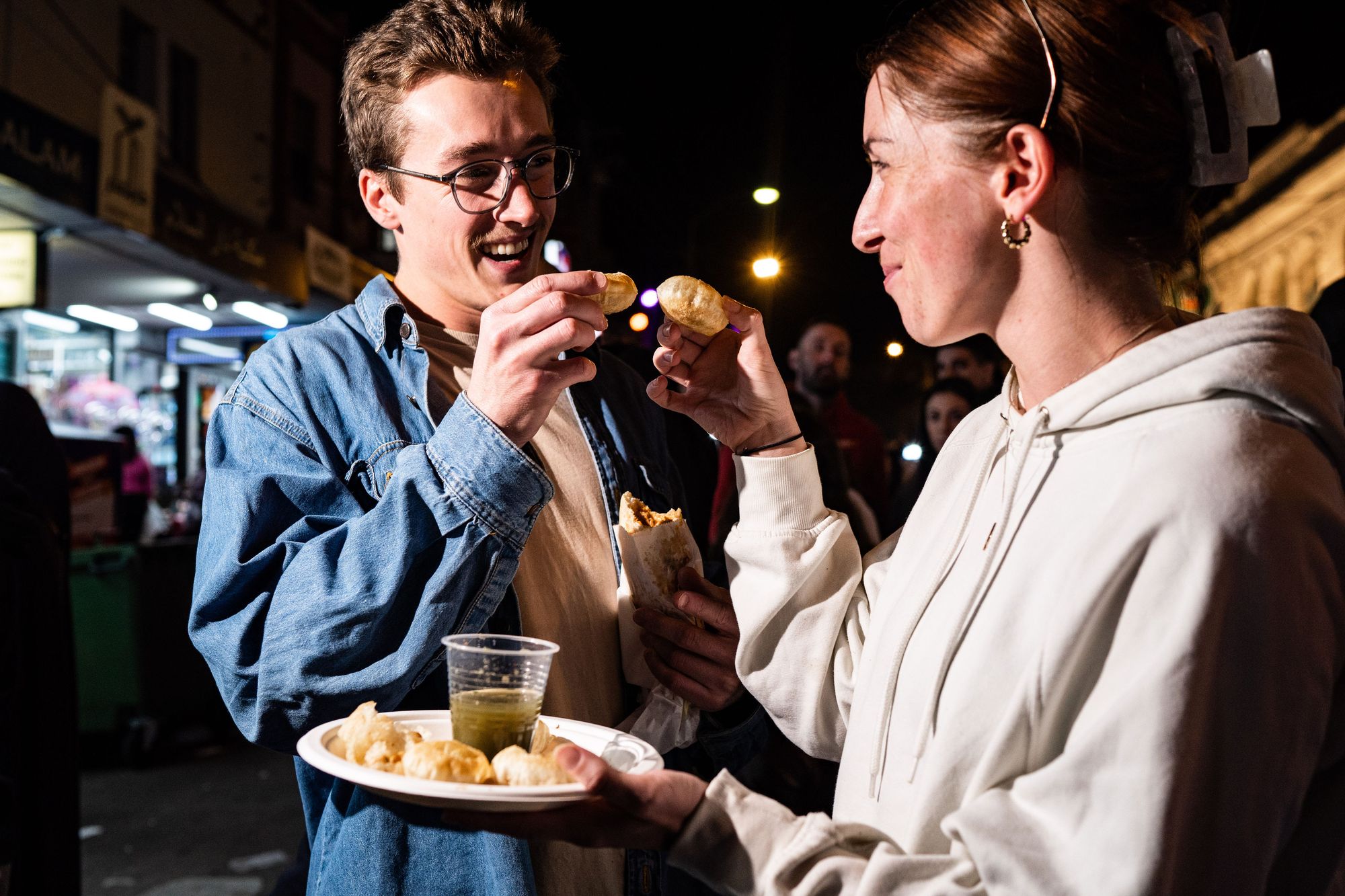 Man and woman enjoy their food at Lakemba Night During Ramadan