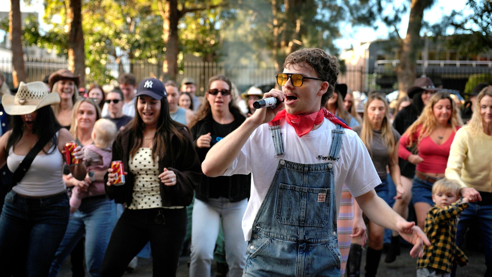 Crowd enjoying country line dancing.