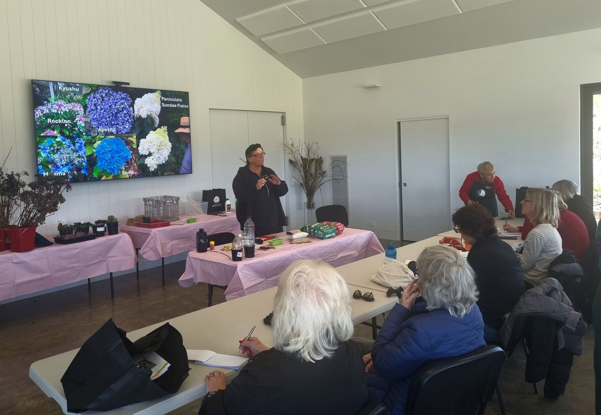 Attendees seated at Bunya Pavilion in the grounds of the Southern Highlands Botanic Gardens - participating in a propagation workshop