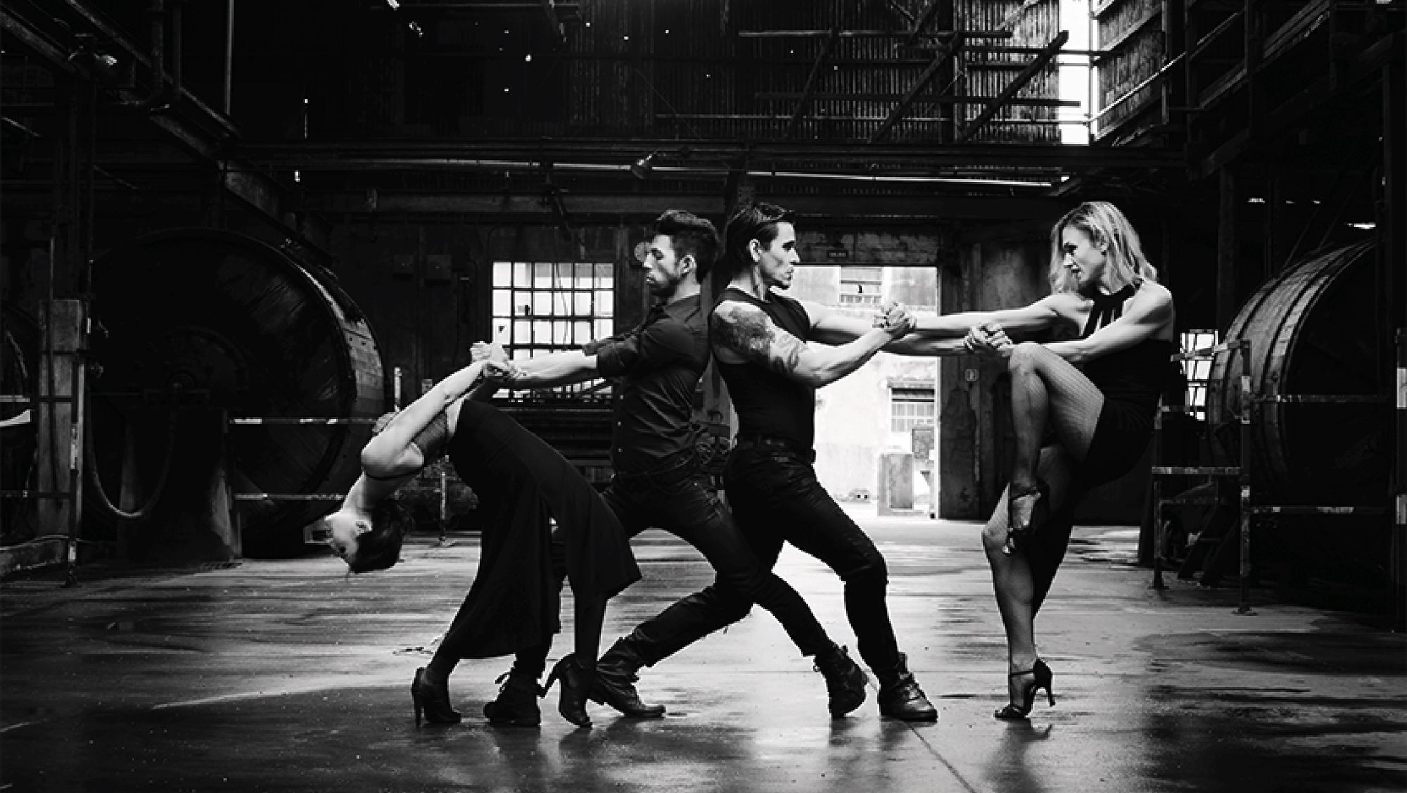 Four dancers at the vanguard of tango, performing in an abandoned warehouse.