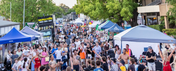 Crowds gathered around street entertainment and market stalls