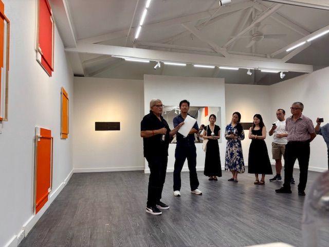Shows exhibition space during gallery opening