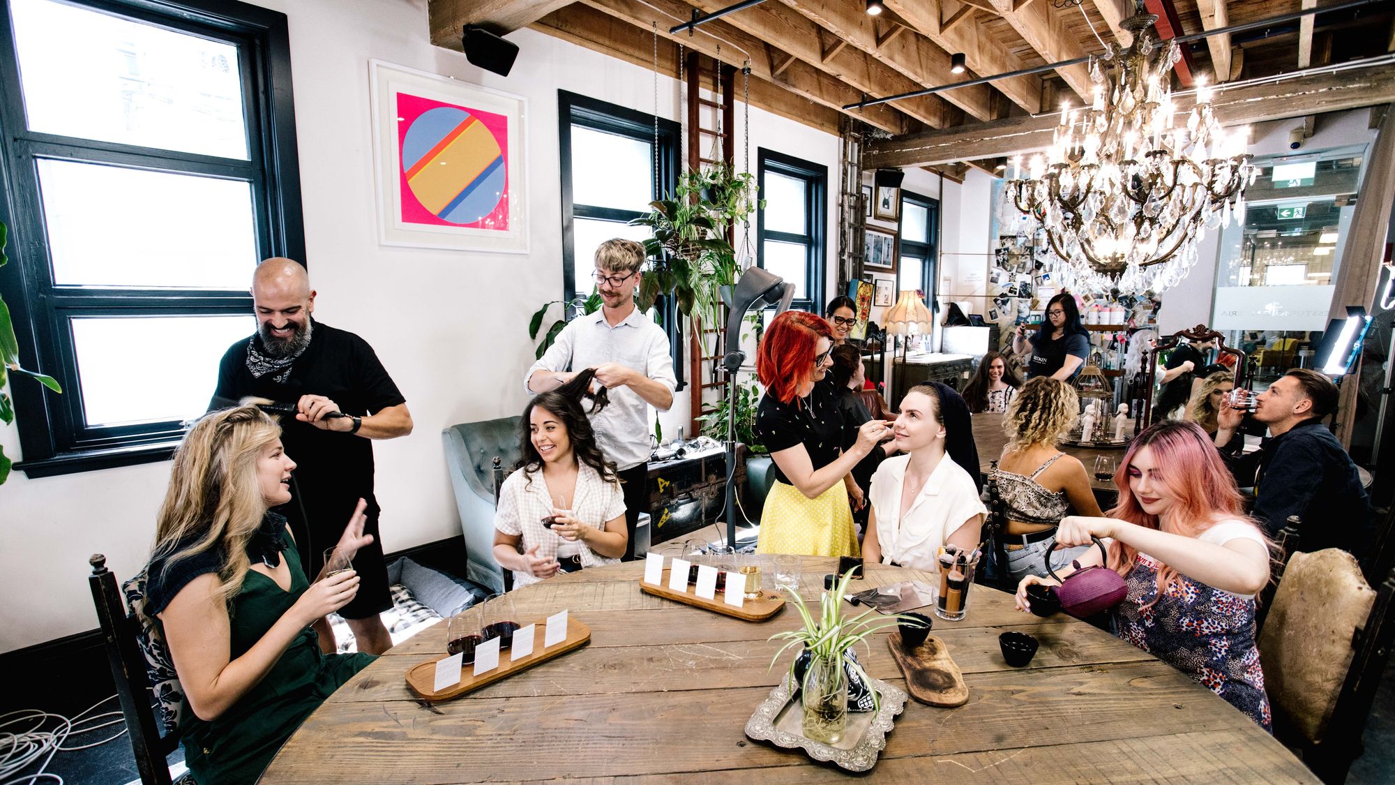 A group of hair and beauty specialists looking after clients