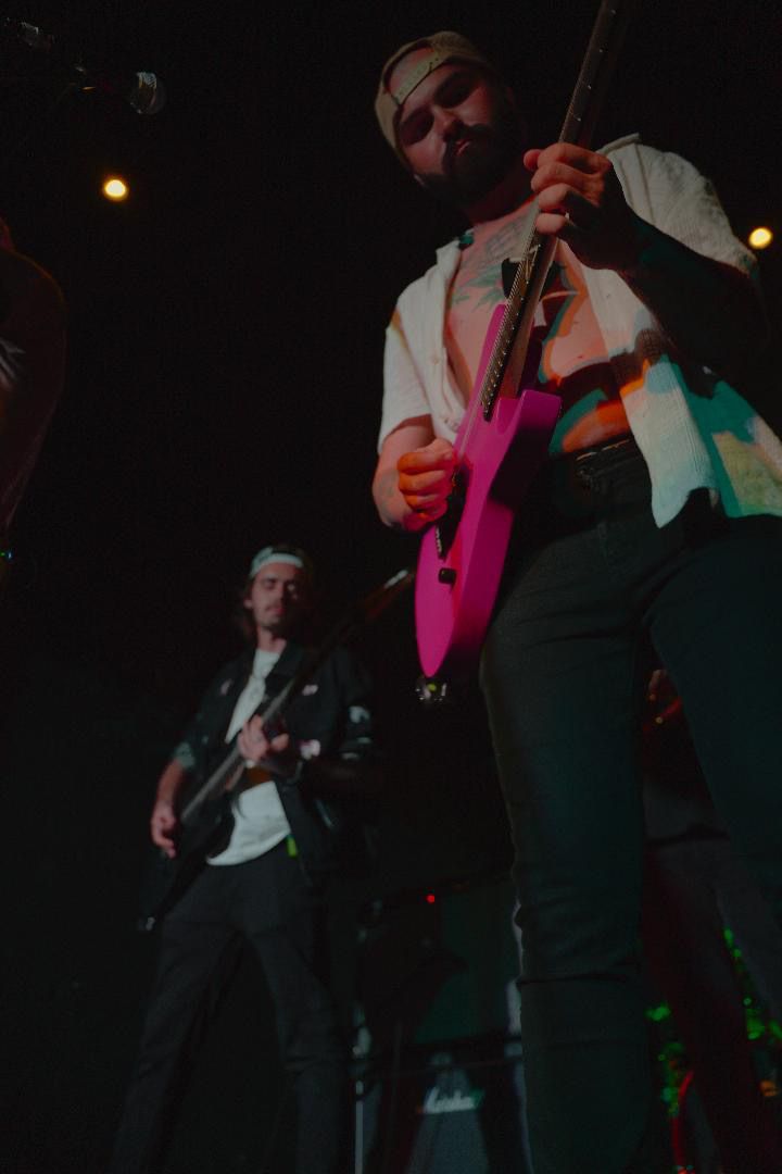 Two men playing guitars