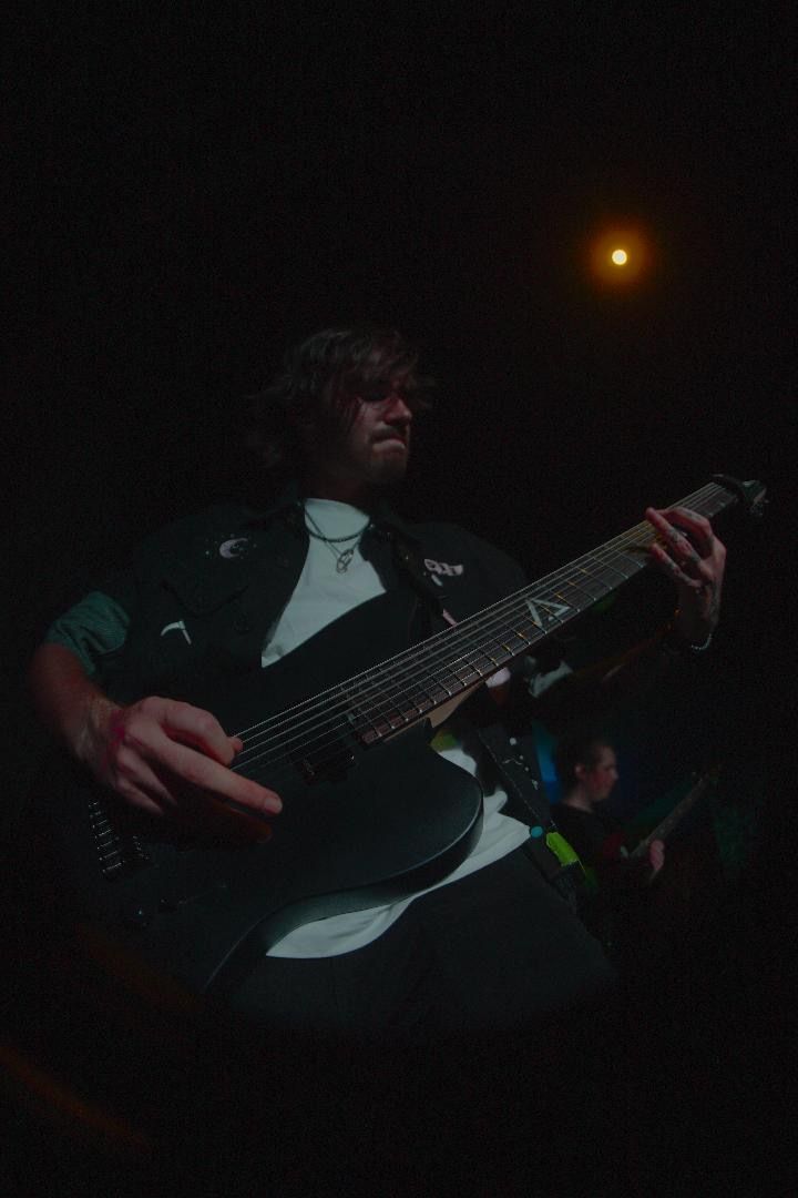 Two men playing guitars