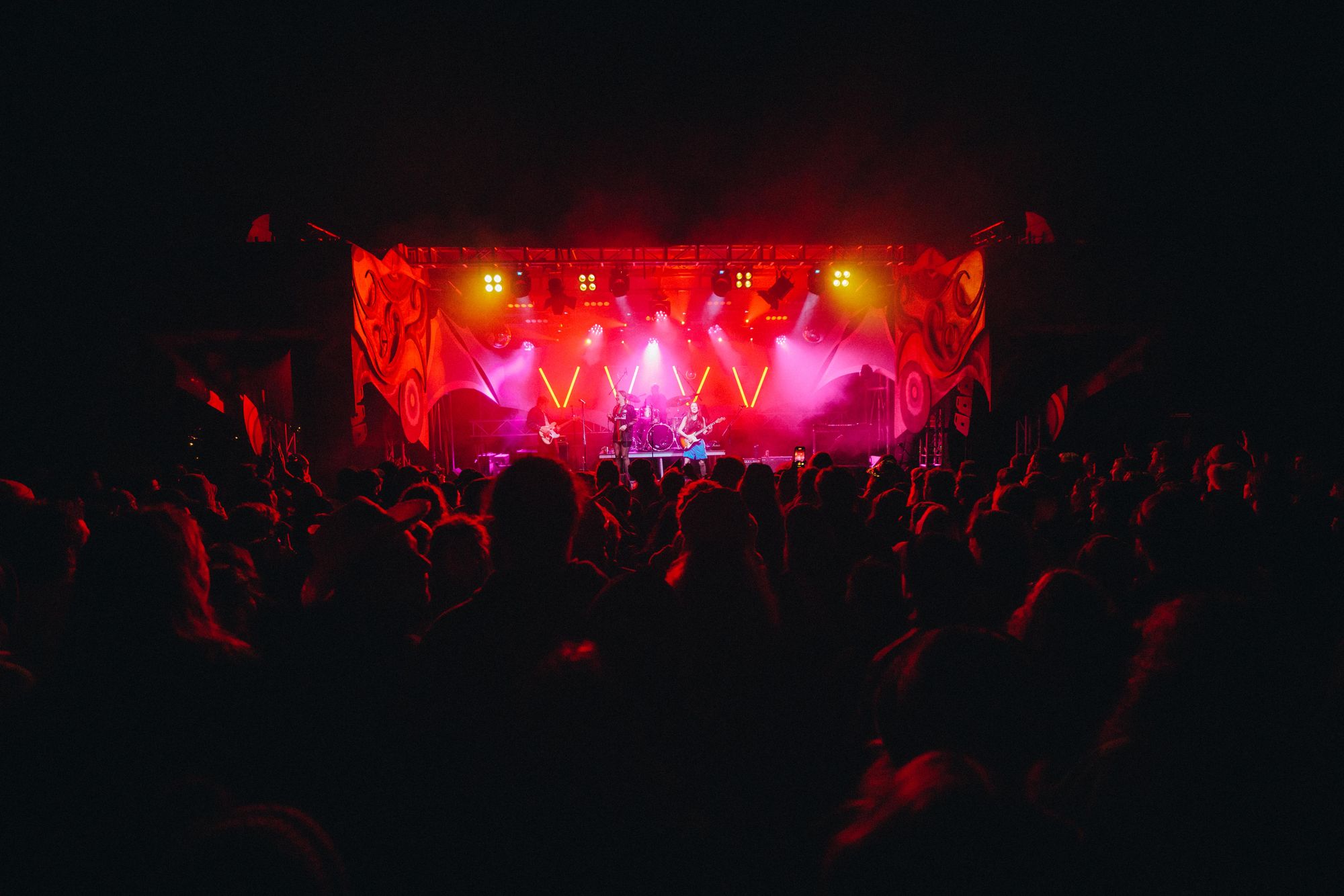 People dancing in front of a stage