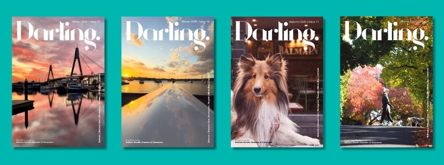Four "Darling" magazine covers featuring a sunset harbor, a coastal sunset, a dog with a drink, and a person walking under autumn trees.