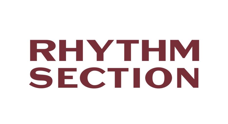 Text saying "RHYTHM SECTION" in bold, dark red capital letters on a white background.