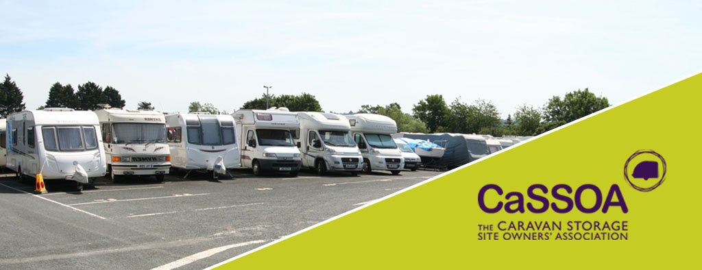 Caravan parked at a campsite, family enjoying the outdoors, motorhome security in mind.