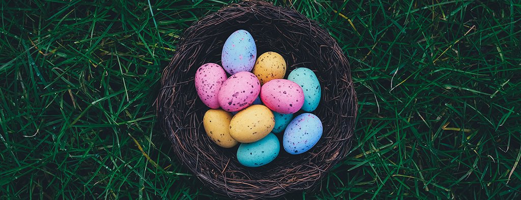 Family enjoying an Easter camping holiday near the seaside in their campervan.