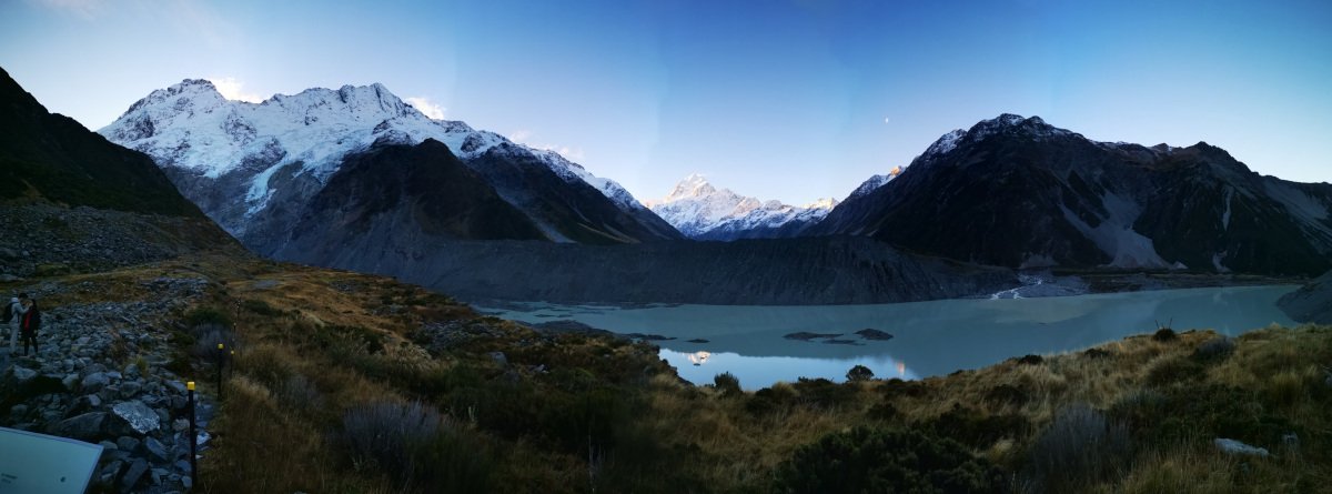 Wild camping spot in Aotearoa. Tent set up by a stunning mountain range in the South Island.