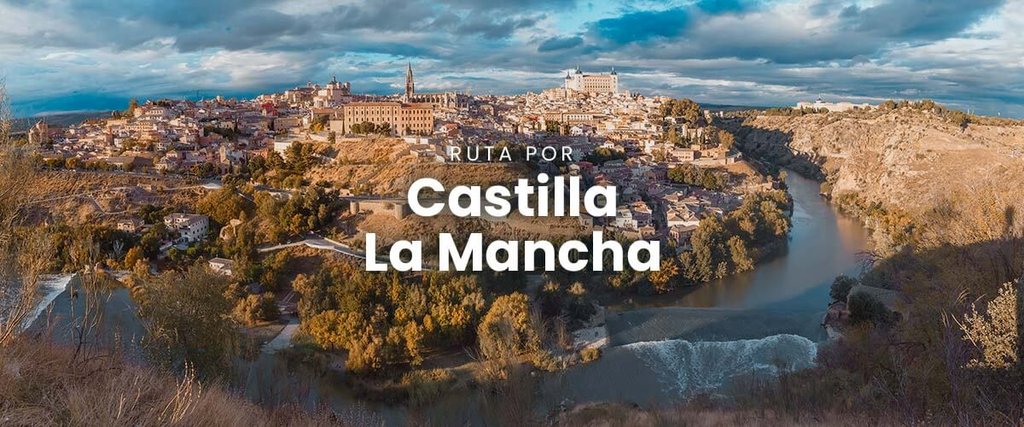 Autocaravana en campo manchego con molinos de viento al fondo, ruta por Castilla-La Mancha.