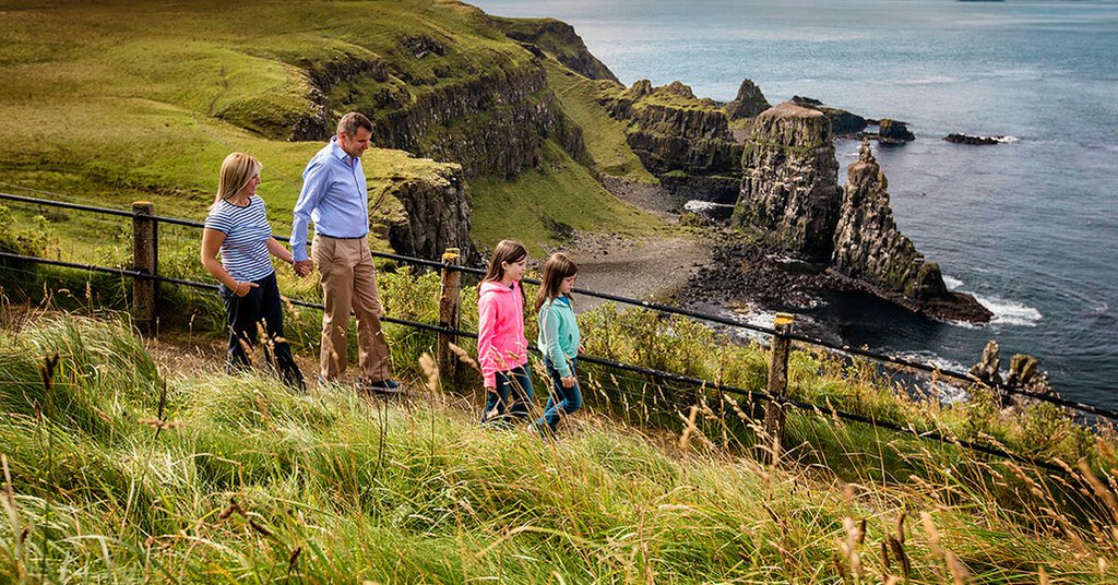 Family enjoys caravan holiday at scenic Northern Ireland campsite.