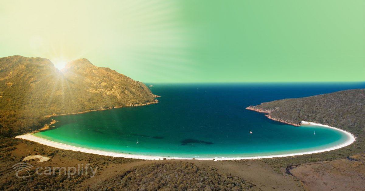 Caravan parked at a sunny coastal caravan park, ready for a ripper Aussie road trip.