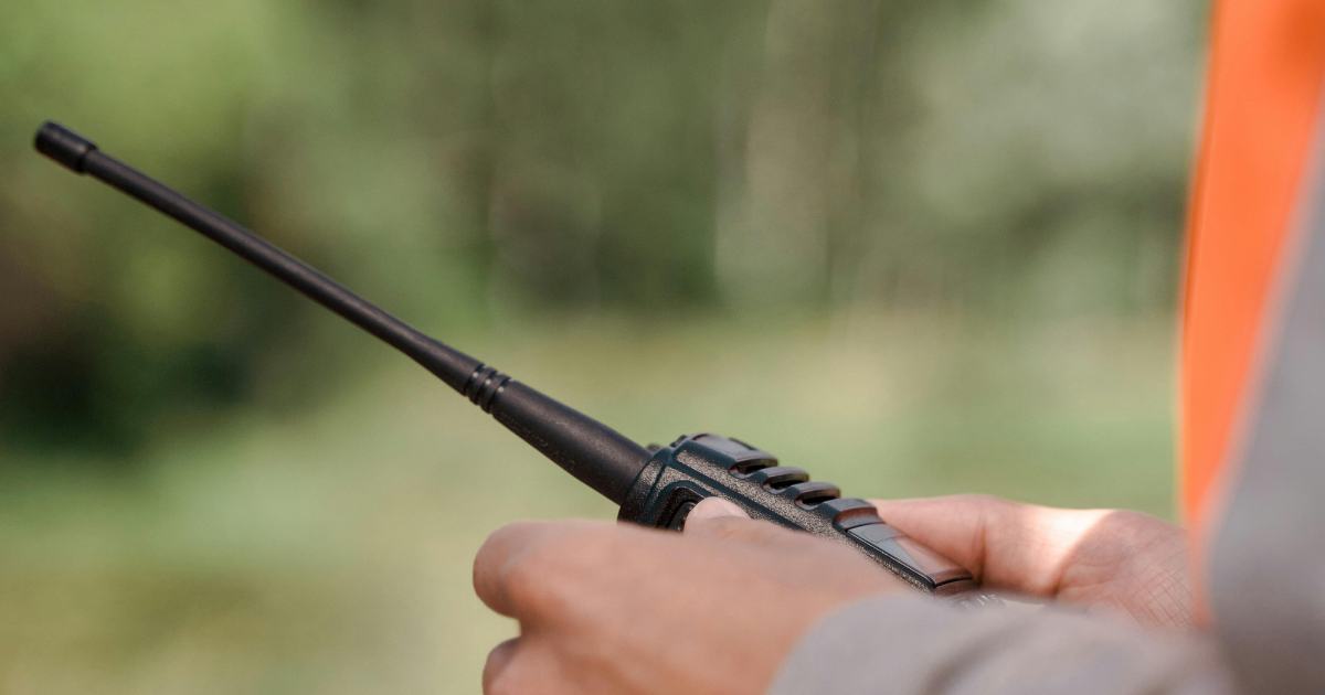 Someone holding a UHF radio