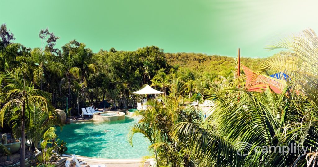 Luxury caravan park with pool and palm trees on the sunny East Coast.