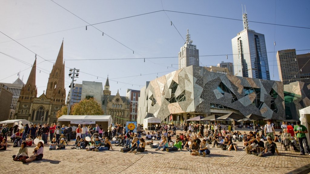 Melbourne skyline over the Yarra River at twilight, a vibrant and bustling city.