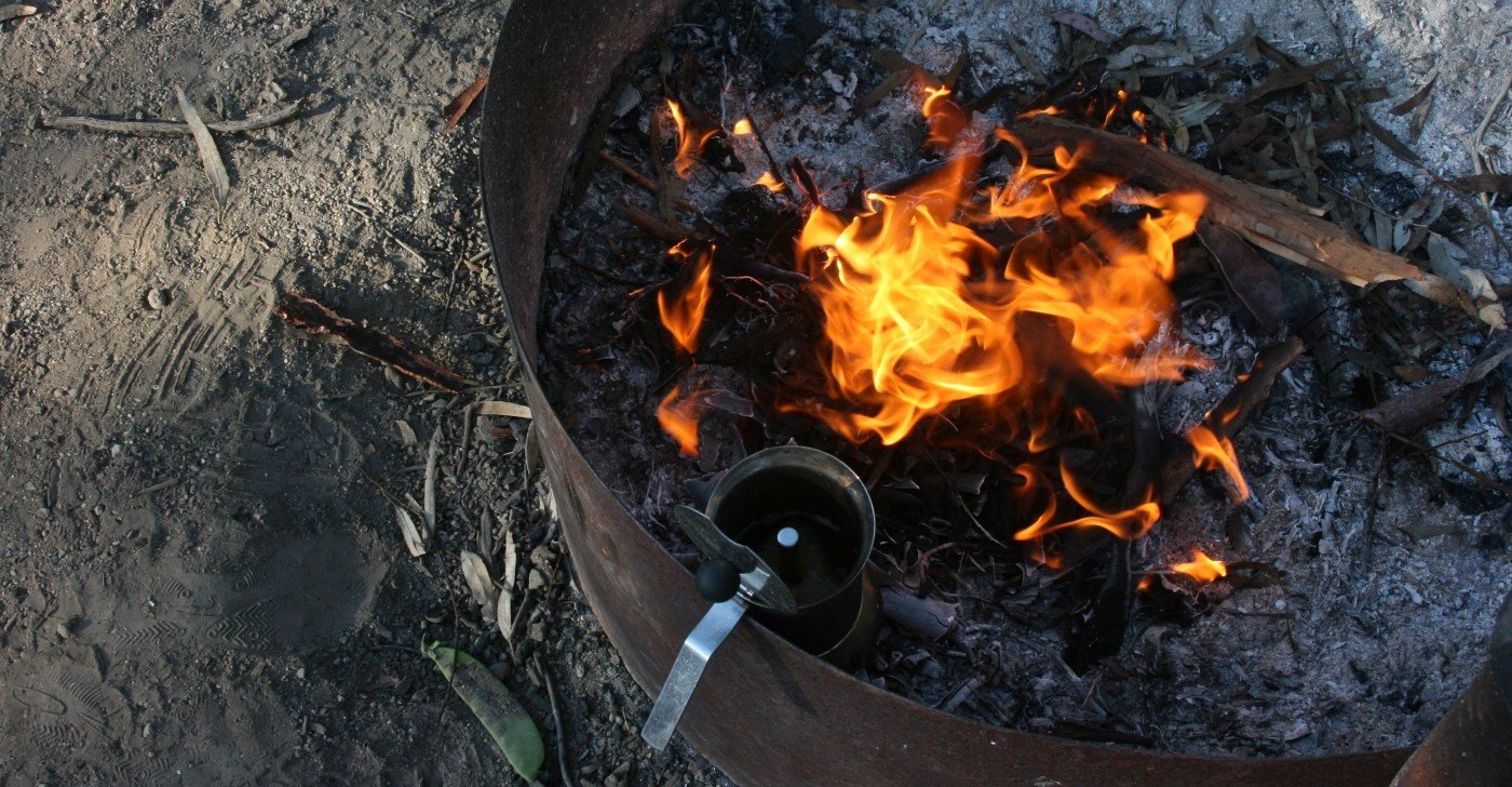 Caravan brekkie spread with bushland view. Healthy start to a camping adventure, mate!