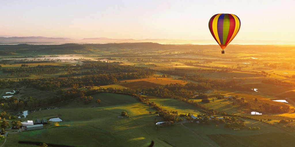 Loved-up couple camping under the stars in the Aussie outback, perfect for a romantic getaway.