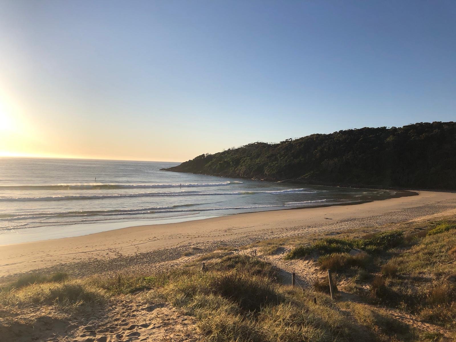 Family caravan holiday: RV parked at a beachside caravan park, perfect for first-time caravanners.