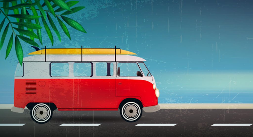 Campervan parked near a beach, perfect for a school holiday road trip.