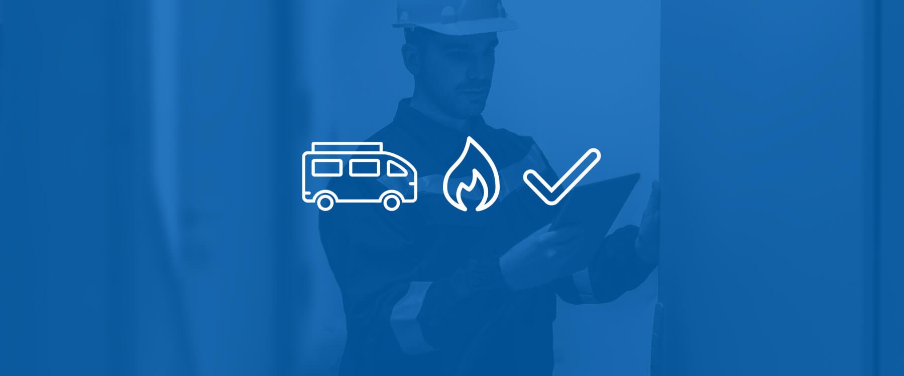 Campervan parked at a campsite, with mountains in the background.