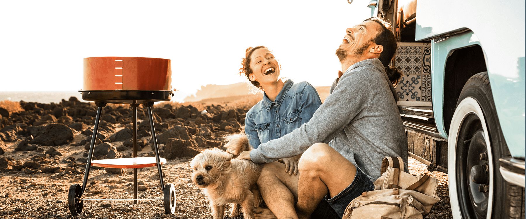 Family camping holiday in Wales, with tent pitched by stunning mountain view.