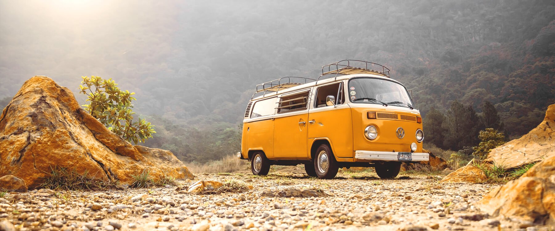 Campervan parked up in the Lake District with mountains in the background.