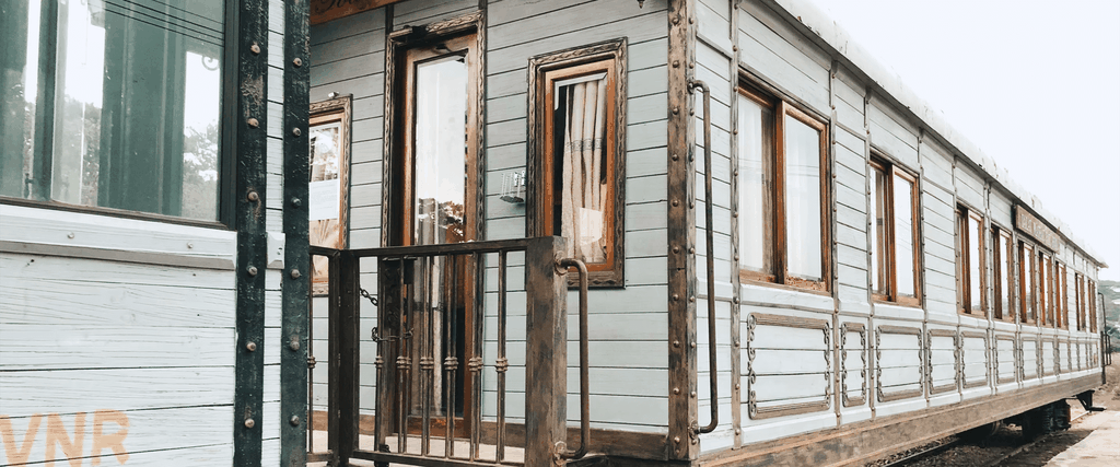 Caravan parked at a sunny campsite; ideal for holiday home insurance.