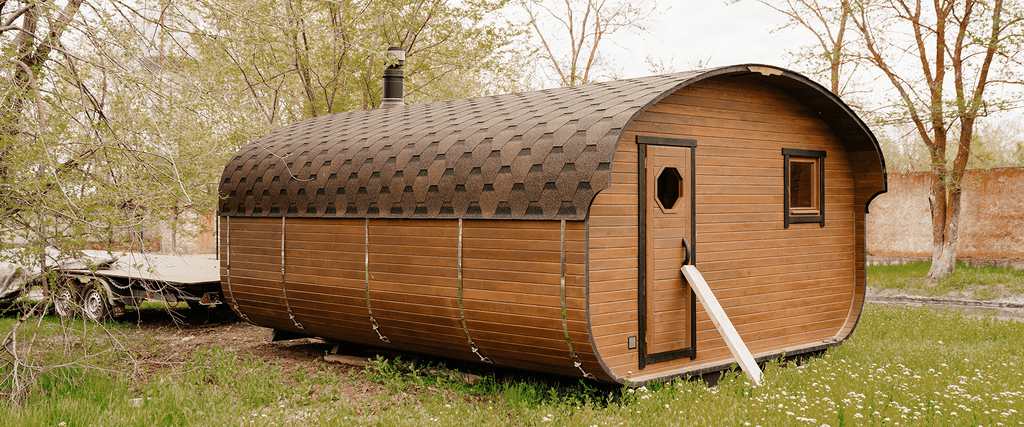 Static caravan parked at a sunny caravan park, holiday homes in the background.