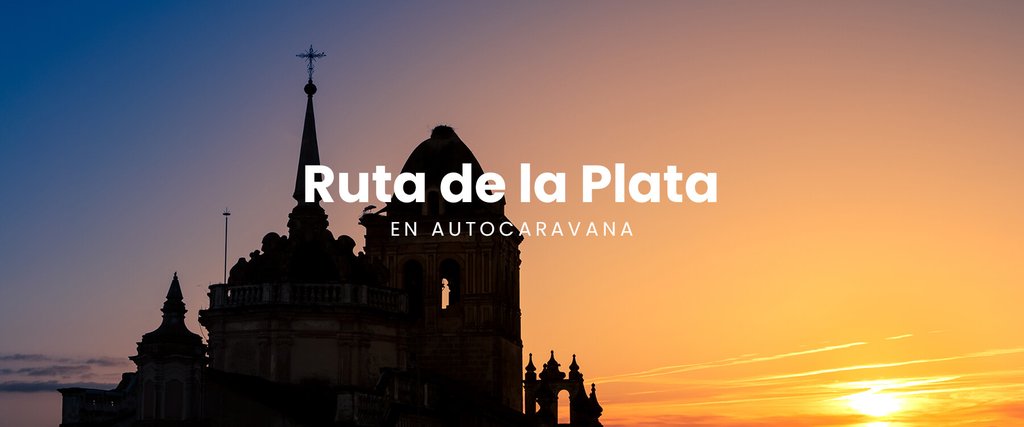 Autocaravana en la Ruta de la Plata con paisaje histórico al fondo. Viaje y turismo en camper.